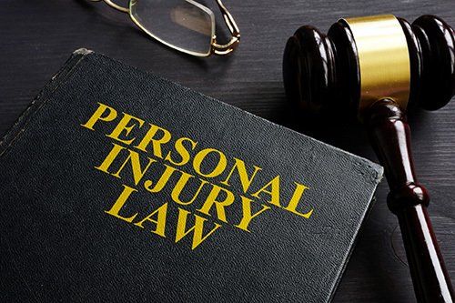 Personal Injury Law Book and a Gavel — Danville, KY — McClure & McClure